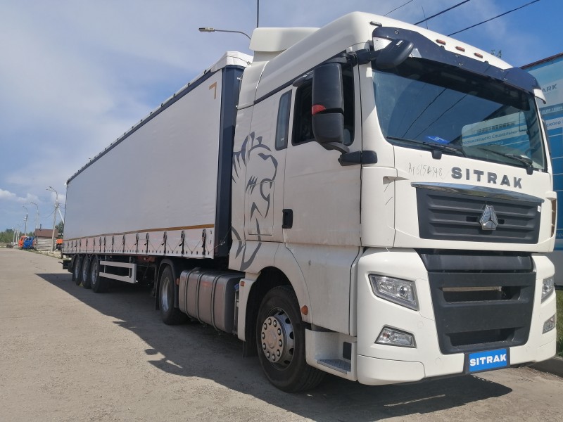 Автомобиль-тягач SITRAK C7H 4х2 + Полуприцеп шторный UAT SCFG 9226.01